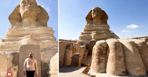 خلف سياج الممنوع مصري يوثق زاوية نادرة لـ لوحة الحلم بين قدمي أبو الهول خلف سياج الممنوع مصري يوثق زاوية نادرة لـ لوحة الحلم بين قدمي أبو الهول