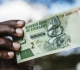 zimbabwe gold backed currency undervalued against dollar central bank