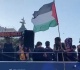 barcelona player lamine yamal waves palestinian flag at parade