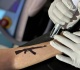 fear is real why young kashmiris are removing tattoos of guns freedom