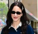 superman actress rocks miniskirt and ruby red heels for nyc stroll