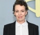 olivia colman 52 stuns with long gray curls on the green carpet