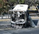 burnt vehicles line highway near mexican world cup stadium