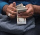 iraq devalues dinar to ease cash crunch leaving traders in limbo