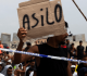 moroccan migrants stage sit in as thousands remain stranded in ceuta