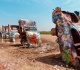 in 1974 three artists buried 10 cadillacs nose first in an amarillo texas wheat field the row was moved 2 miles west in 1997 as the city grew
