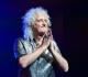 queen s brian may admits a return to the u s is unlikely it s a dangerous place