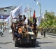 photos patriotic music and flags mark taliban rule anniversary in kabul