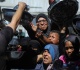 photos gaza mothers endure endless lines as famine fears persist
