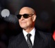 stanley tucci and his wife emily blunt s lookalike sister have a sweet red carpet kiss
