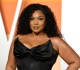 lizzo flaunts slimmed down figure in colorful bikini after weight loss
